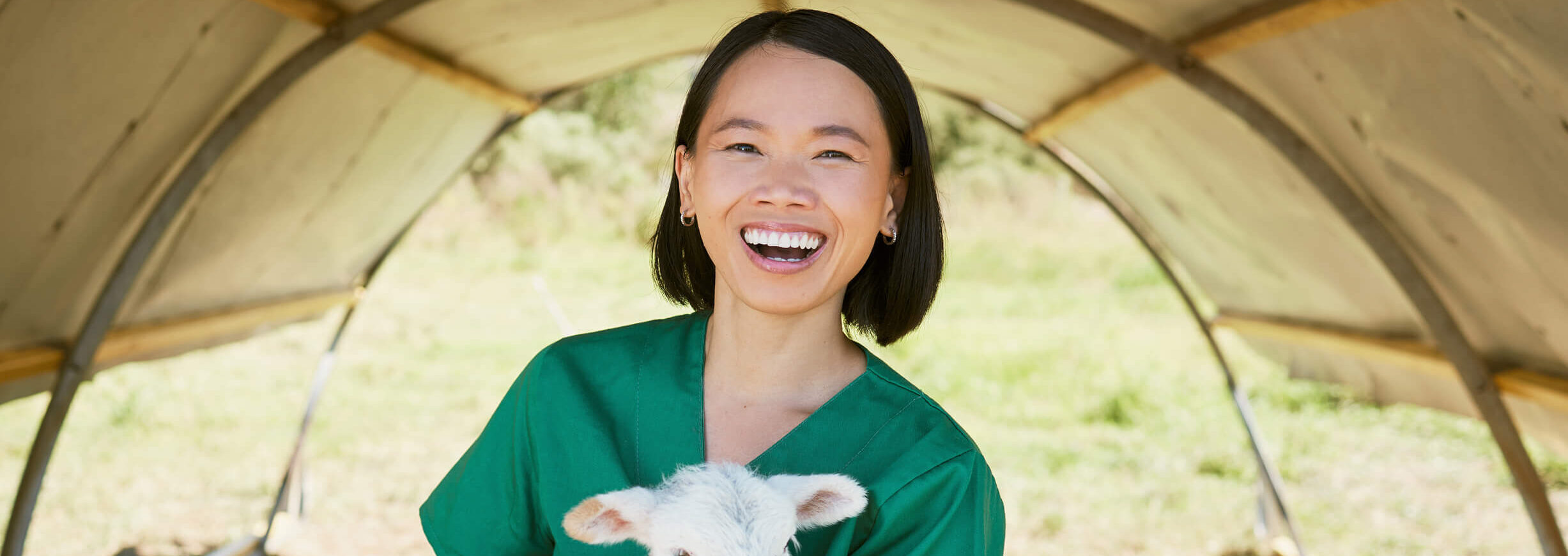 Female-vet-holding-sheep-in-her-hand